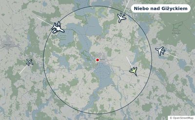 Mapa okolic miasta z sylwetkami samolotów — Niebo nad Giżyckiem na żywo